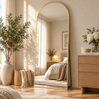 Warm aesthetic bedroom styled with a luxury oversized arched full length floor mirror by HavvakHome.
