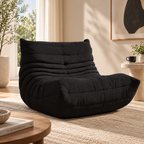 HavvakHome black bouclé lounge chair in a modern living room setting.