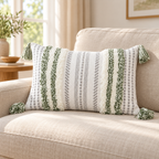 Green and cream white 20x12 lumbar tufted pillow cover with tassels on an oatmeal sofa.