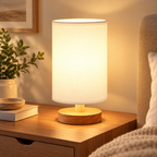 A cozy bedroom corner featuring a minimalist small table lamp with cream shade by HavvakHome.
