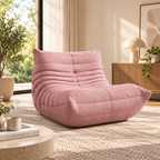 A cozy modern living room interior featuring a dusty pink bouclé lounge chair by HavvakHome.