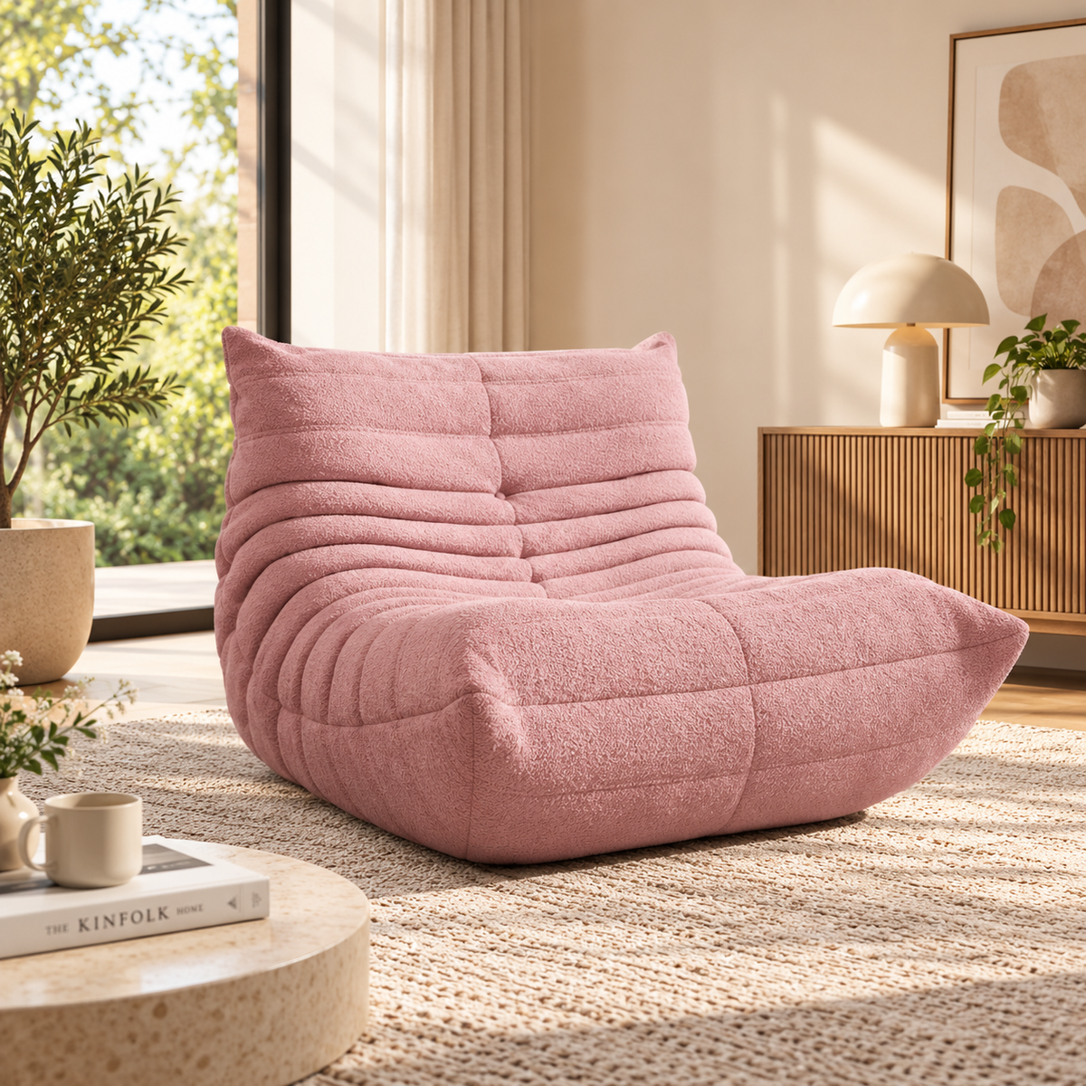 A cozy modern living room interior featuring a dusty pink bouclé lounge chair by HavvakHome.