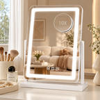 Portrait white LED tabletop mirror with round magnifying attachment marked 10X, touch icons, and a living room reflection by HavvakHome.