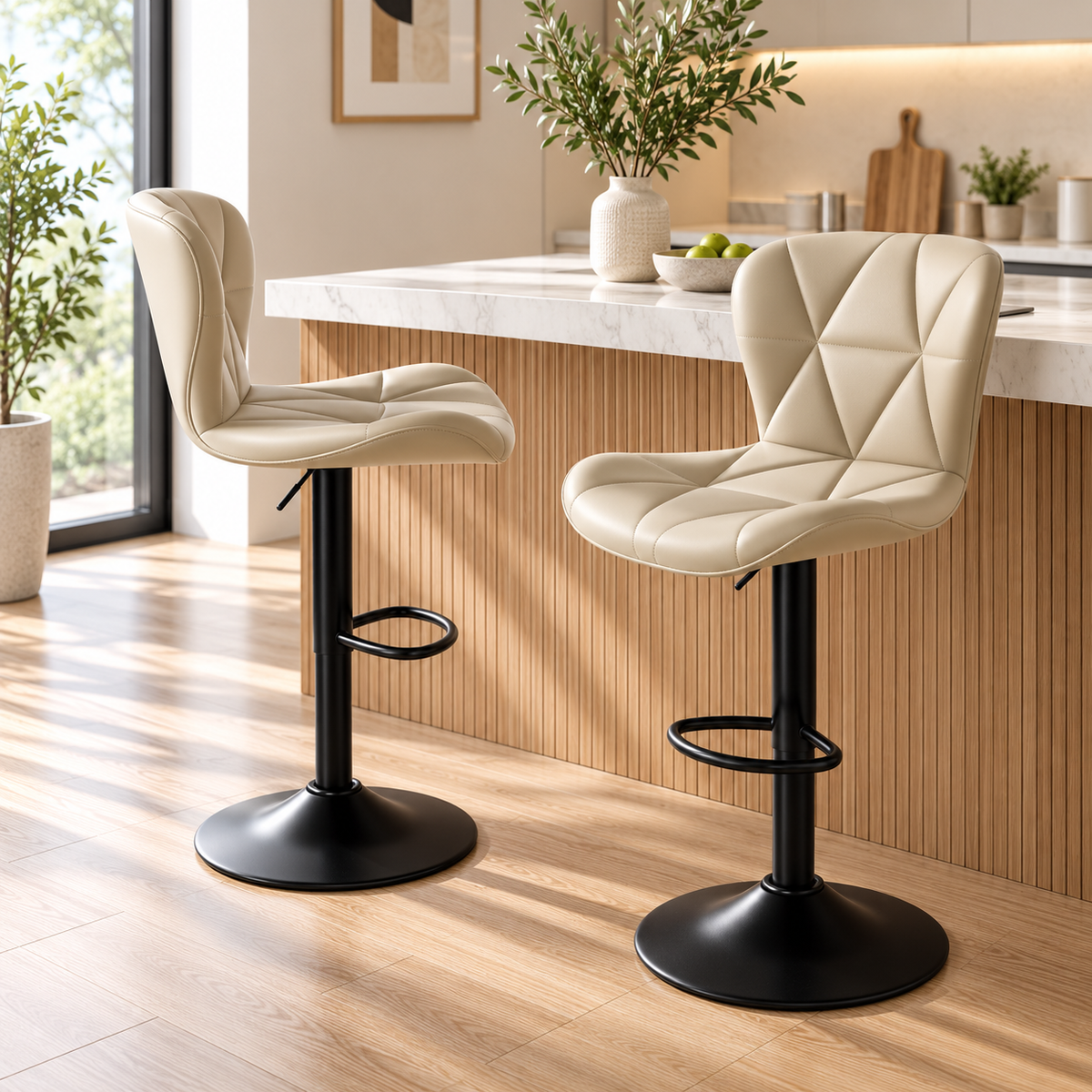 Two beige quilted bar stools with black pedestal bases shown from side and front three-quarter angles beside a kitchen island by HavvakHome.