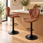 Two brown quilted bar stools with black pedestal bases shown from side and front three-quarter angles beside a kitchen island by HavvakHome.