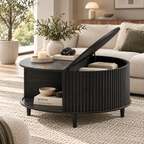 Black round fluted coffee table with half lid lifted revealing books and a blanket, featuring an open side shelf beside a cream sofa by HavvakHome.
