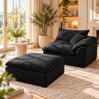 Black modular sofa single seat with matching detached ottoman near a sunny window, potted tree, and fireplace.