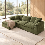 Olive green modular sectional sofa with left chaise and beige throw beside floor-to-ceiling windows.