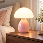 Pink-Ice Crackle ceramic mushroom lamp with a crackle-glazed teardrop base and a white glass dome shade on wooden bedside furniture in a softly lit bedroom.