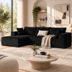Black ribbed L-shaped sectional sofa with a chaise on the left, styled with a cream lumbar pillow and knit throw, resting on a beige rug next to a round coffee table by HavvakHome.
